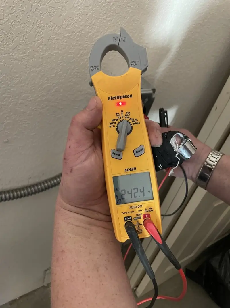 Voltage testing with clamp meter during Electrical Installation Services in East Petersburg